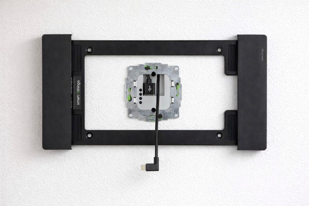 Onzichtbare stroomtoevoer tablet muurhouder